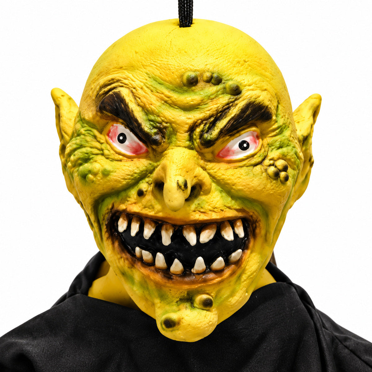 Hanging goblin Halloween monster – close-up of scary face, eyes and teeth