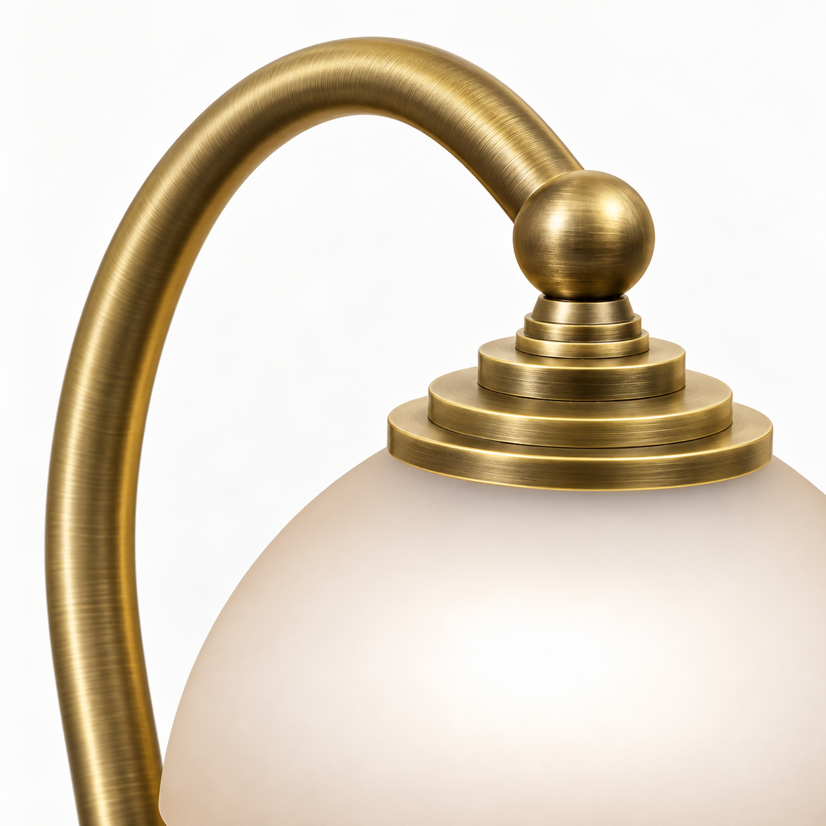 Close-up of the curved brass arm and shade fitting on the Aurora candle warmer lamp