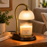 Aurora brass candle warmer lamp with unlit jar candle in a warm living room setting