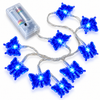 Blue butterfly fairy lights arranged on a white background with battery box