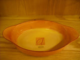 Brown oval ovenproof casserole baking dish with handles