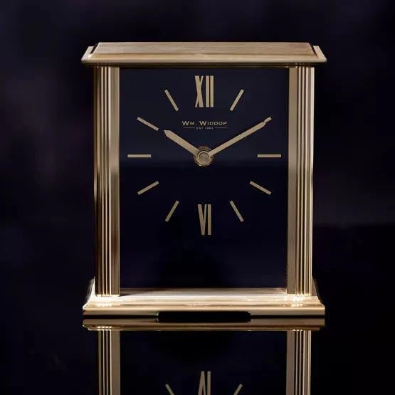 William Widdop gold mantel clock with navy blue dial