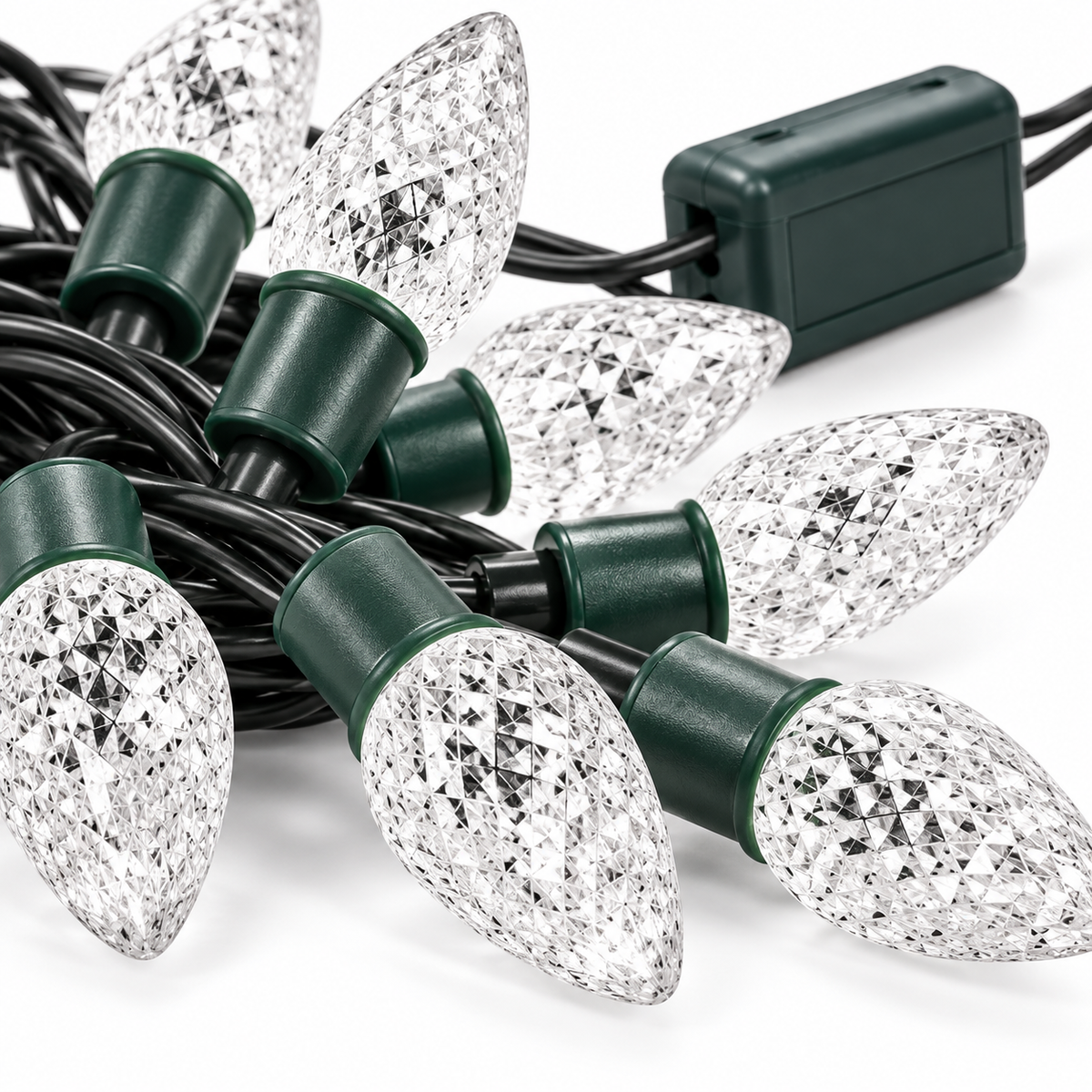 Close-up of clear faceted strawberry LED Christmas light covers