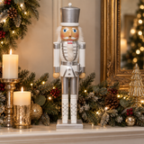50cm white and silver nutcracker soldier in a warm festive room setting