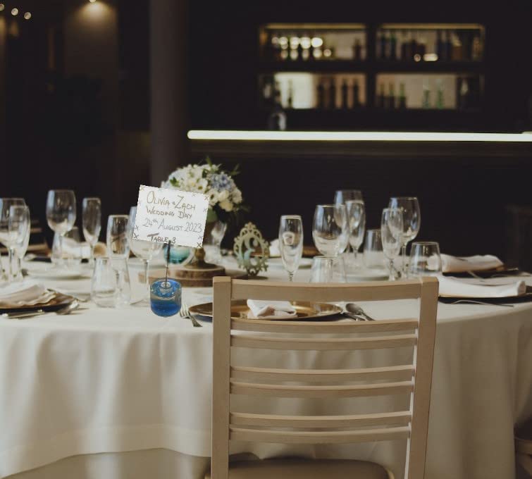 Blue dolphin place card holder for weddings and table settings