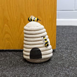 Beehive fabric door stop with beige honeycomb design