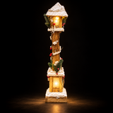 60cm snowy wooden Christmas lamppost illuminated with warm white LEDs against a dark background