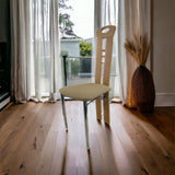 Beech wood dining chair with padded fabric seat and chrome legs