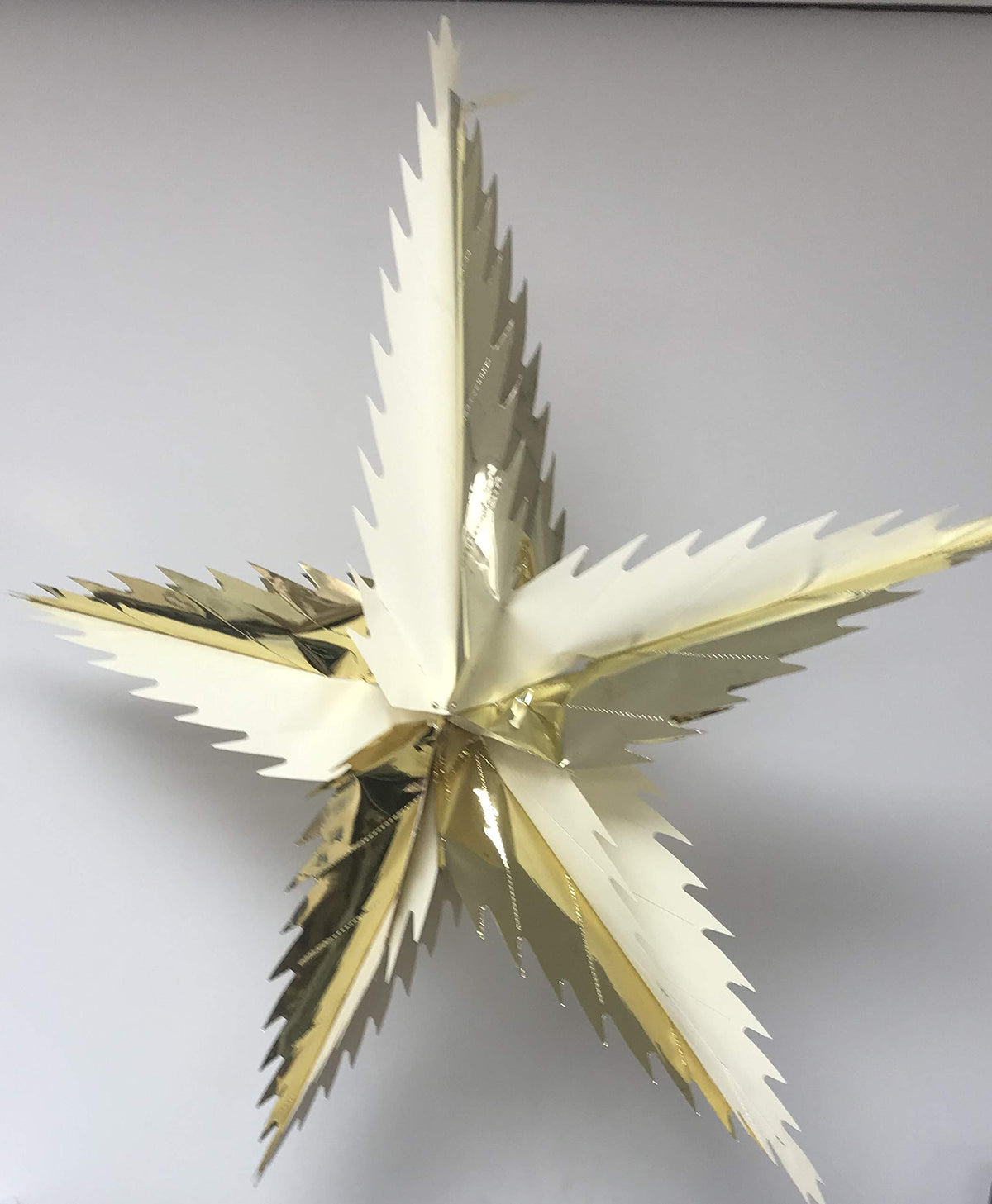 Cream and gold spiky star foil Christmas ceiling decoration