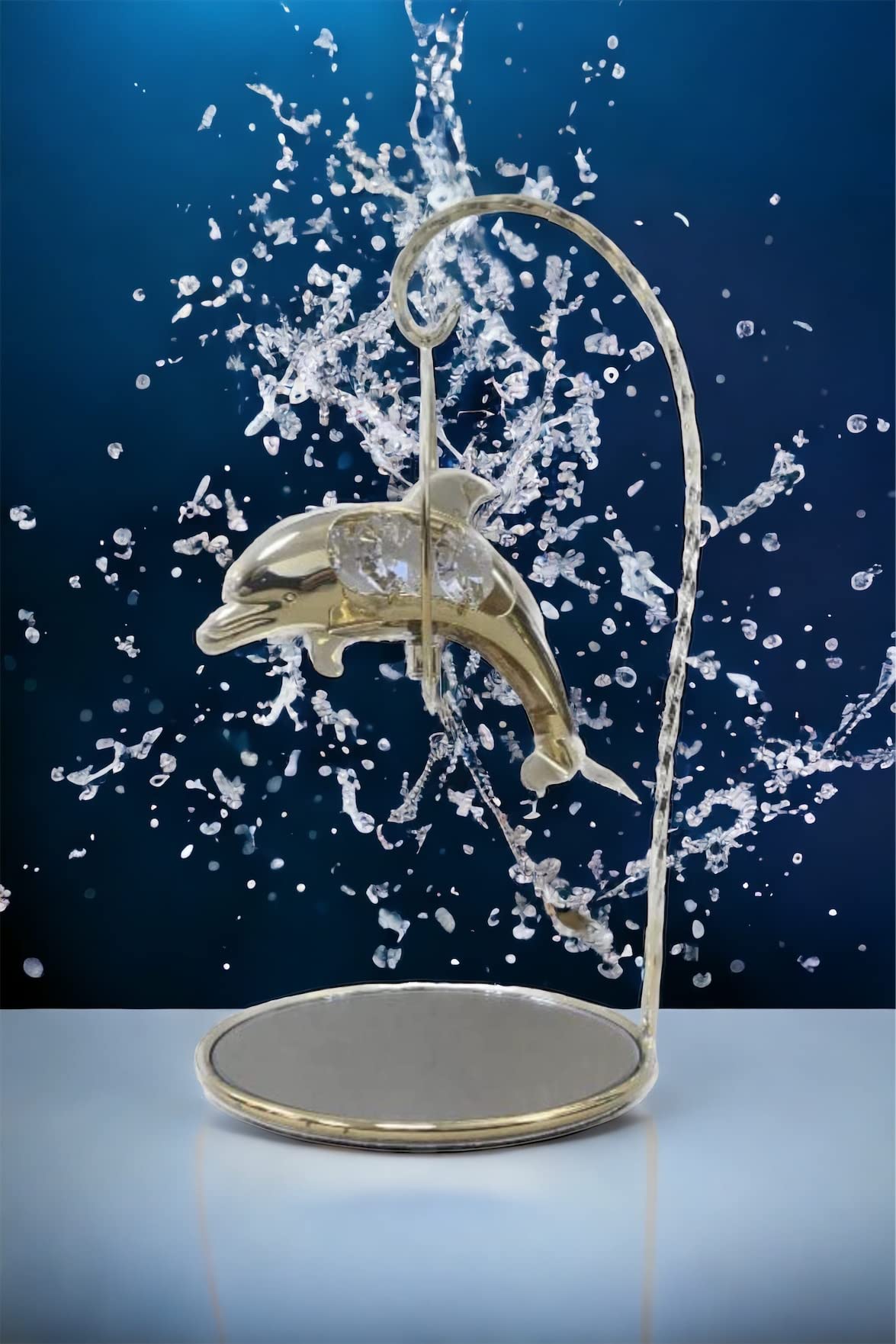 Gold-plated dolphin ornament with crystal detail and mirrored stand