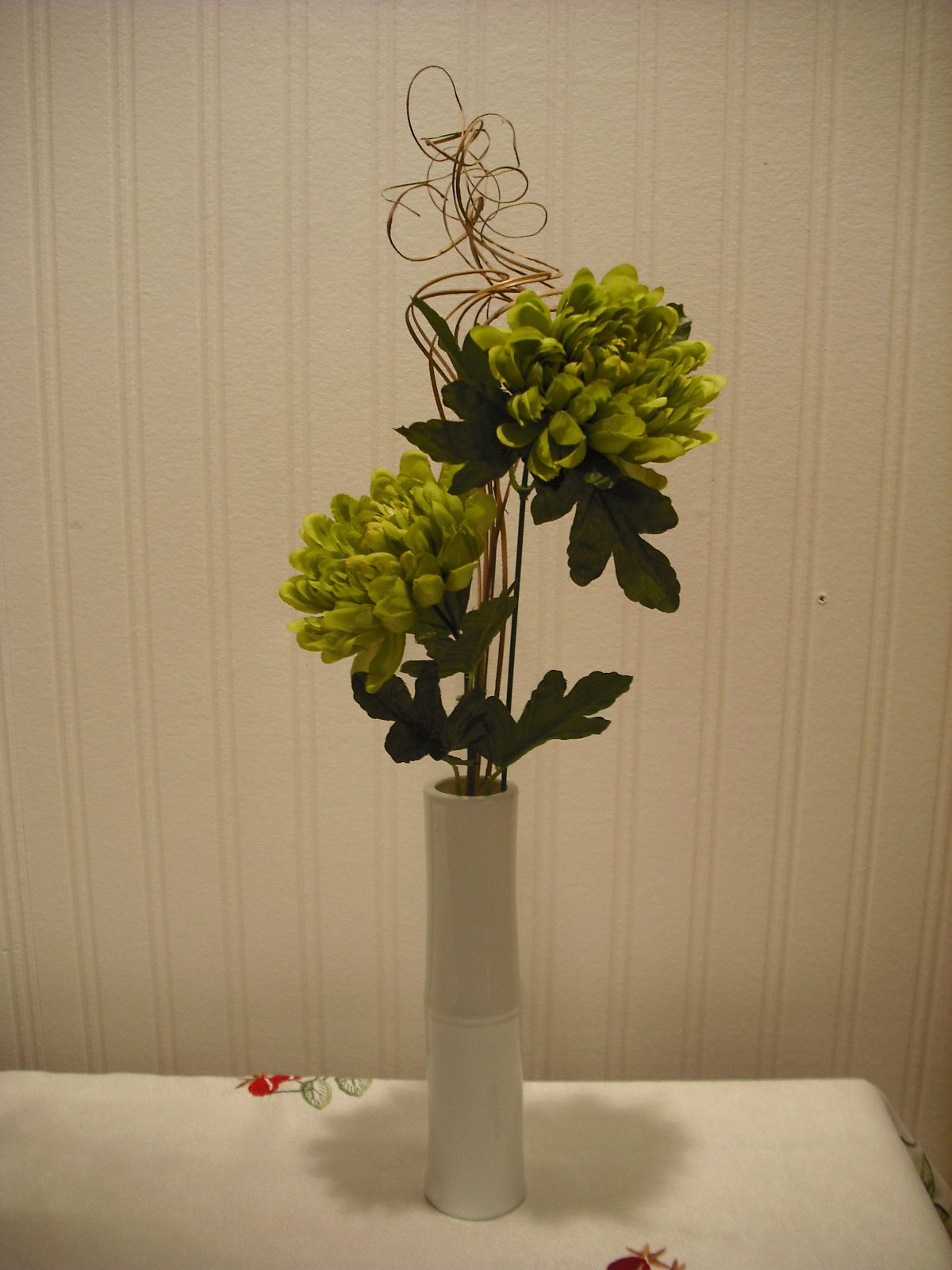 Green artificial flower arrangement in white vase – 53cm