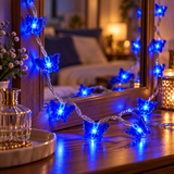 Blue LED butterfly fairy lights displayed around a bedroom mirror