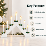 White seven-candle Christmas bridge key features, warm white glow and mains power