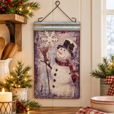Frosty snowman metal wall hanging in a festive kitchen display
