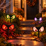 Halloween evil eyes stake lights beside front door pathway