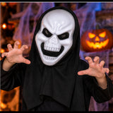 Child wearing white skeleton mask and black hood in a Halloween setting; illustrative image