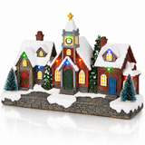 LED Christmas village street scene with houses and church angled view