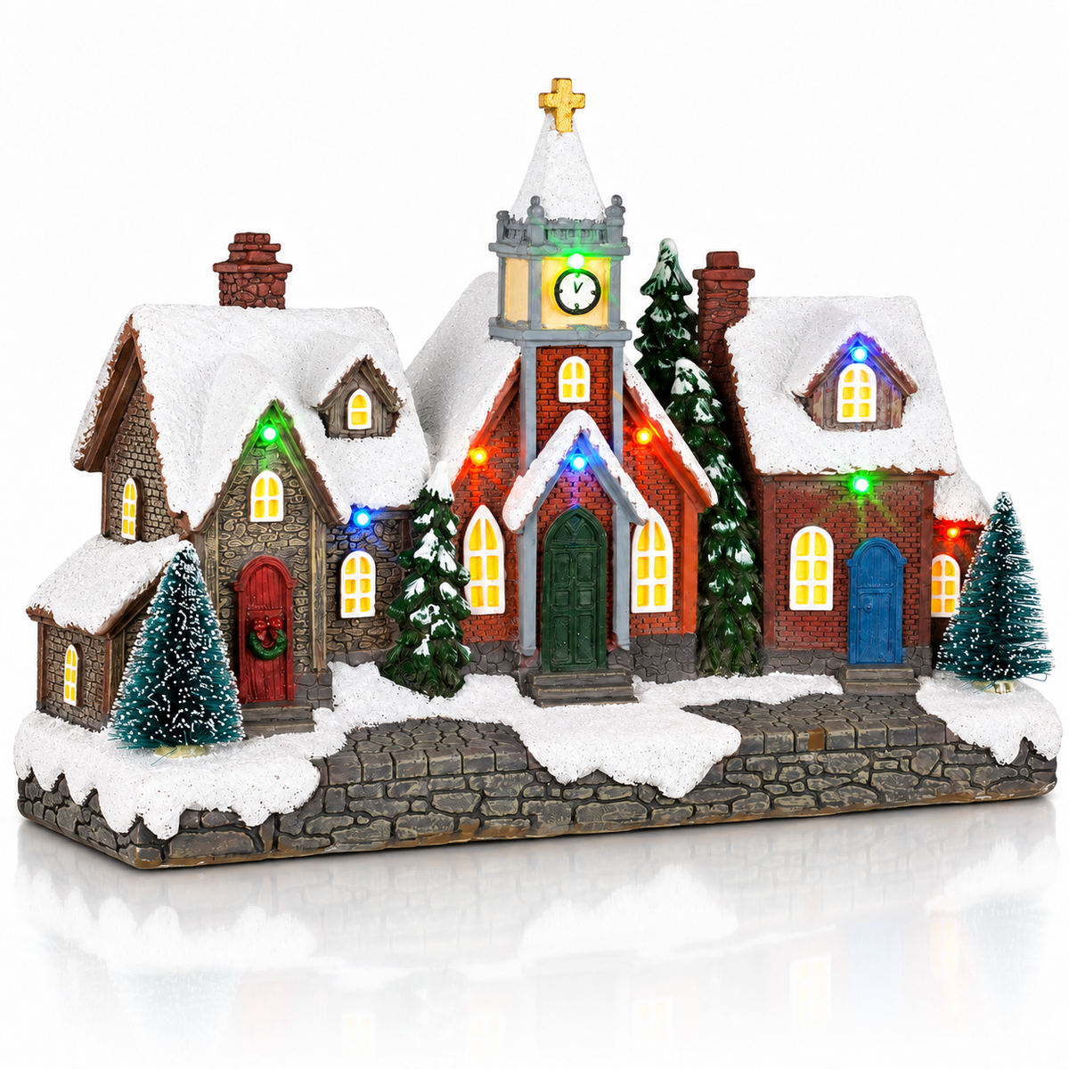 LED Christmas village with houses and church illuminated at night