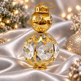 Gold crystal snowman ornament displayed on a Christmas tree