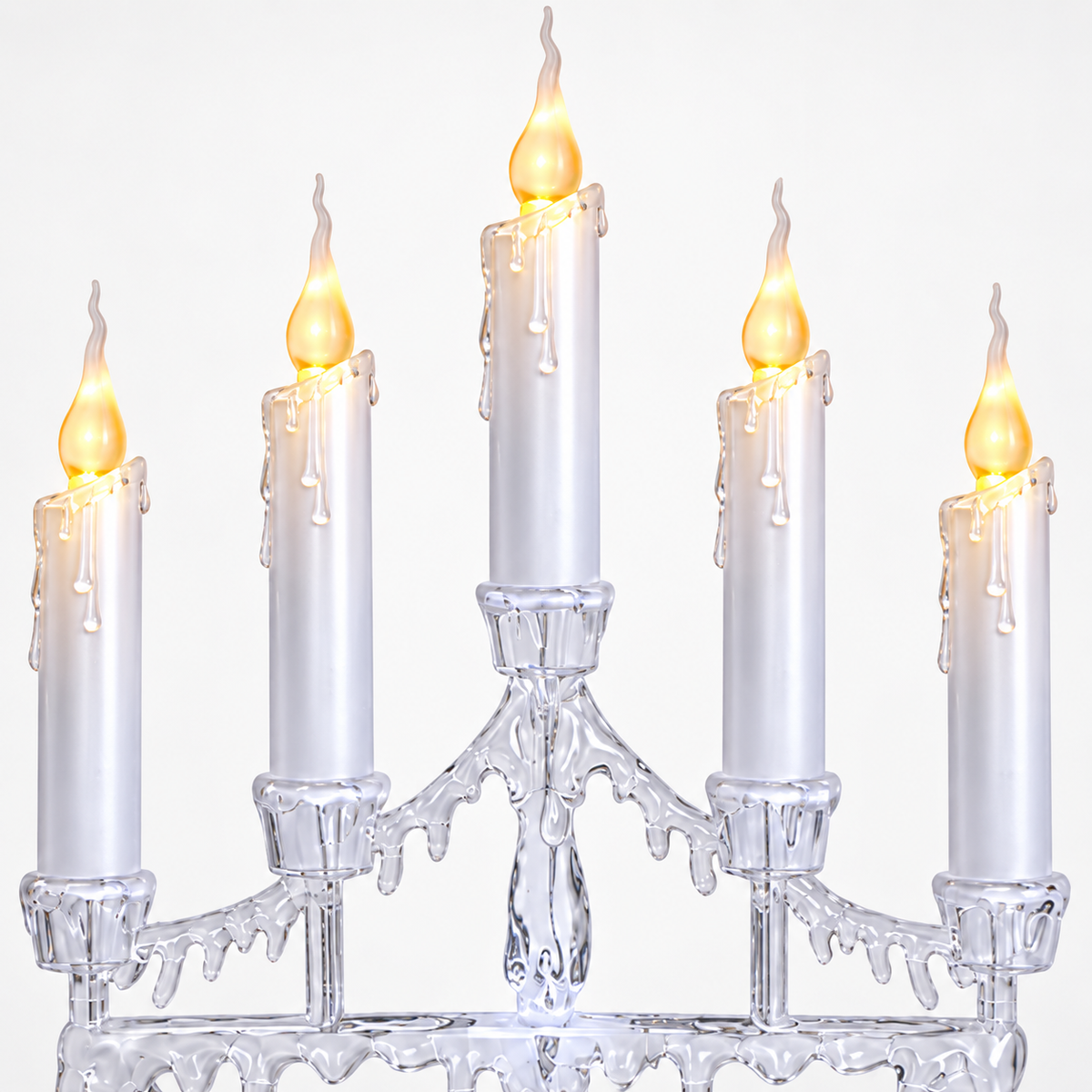 White five-candle LED Christmas candelabra in a festive window display