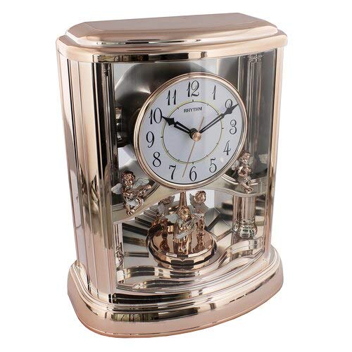 Rhythm rose gold musical mantel clock with rotating pendulum
