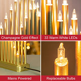 Illuminated champagne gold candle bridge for festive window display