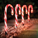 Set of four red and white LED candy cane Christmas path lights