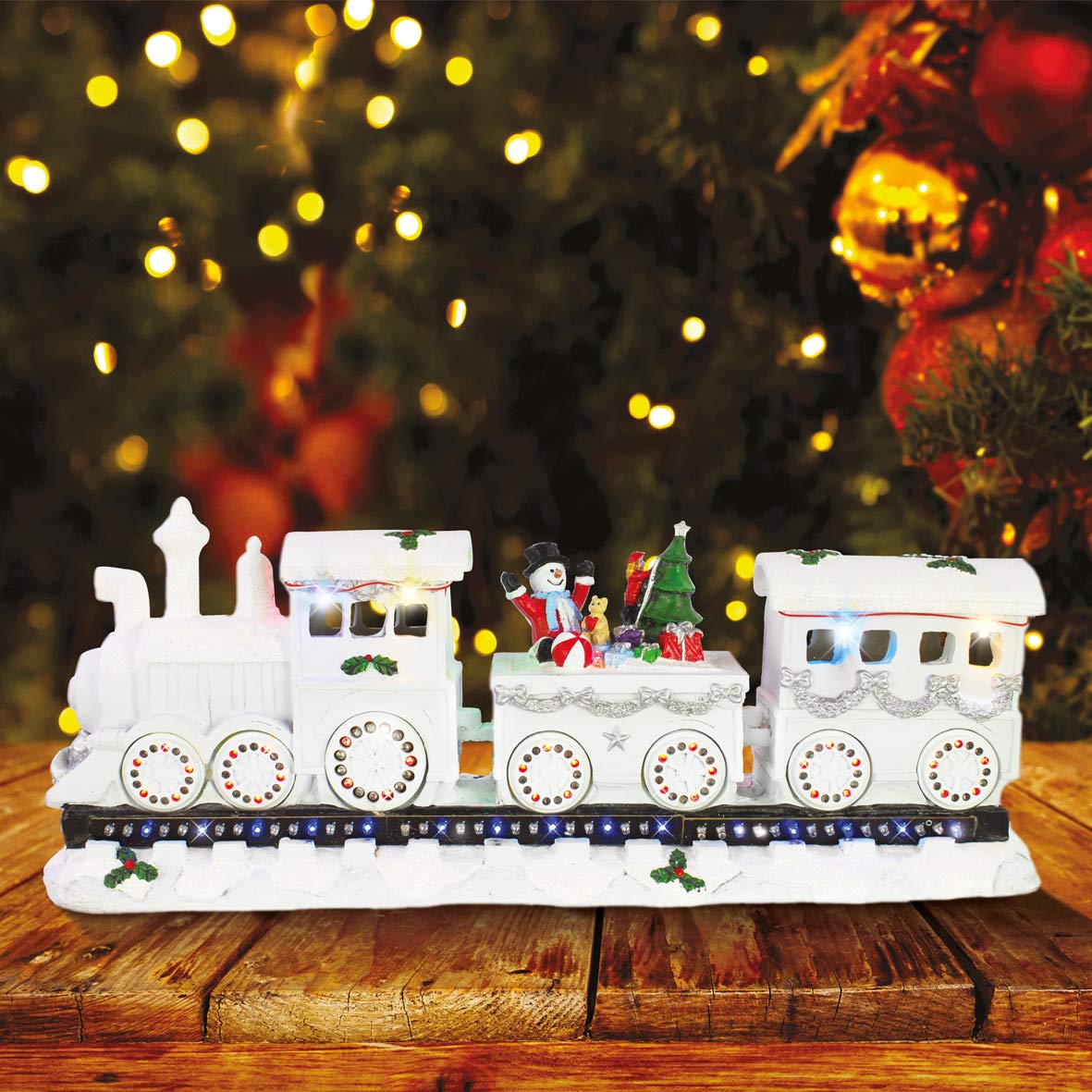 Musical Christmas train scene with eight festive songs