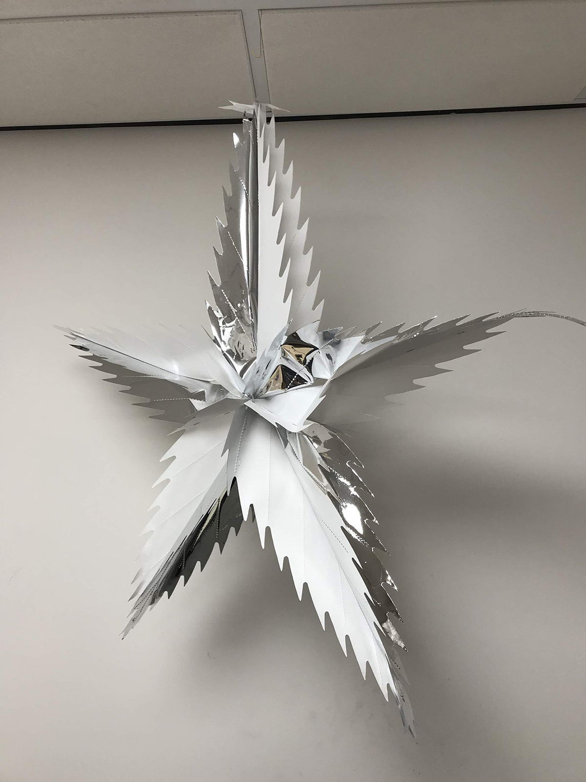 Spiked star foil Christmas decoration detail
