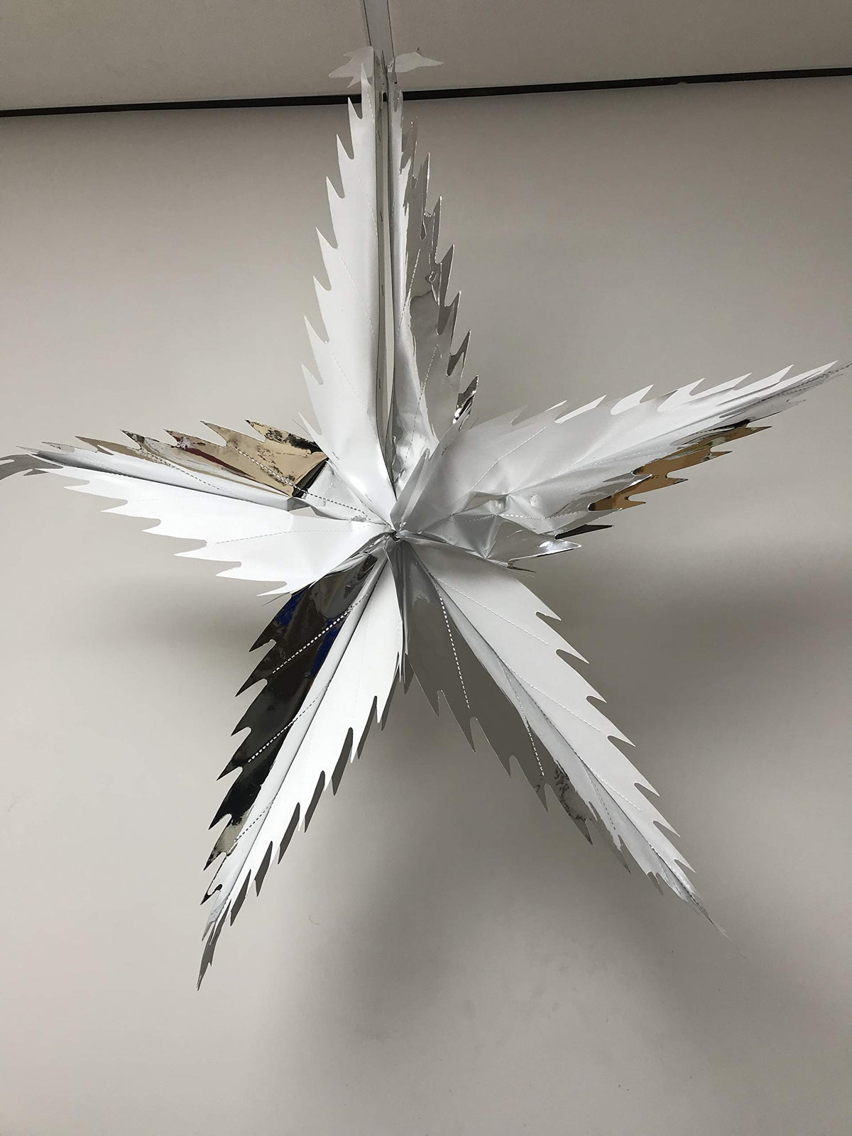Silver and white foil star festive decoration