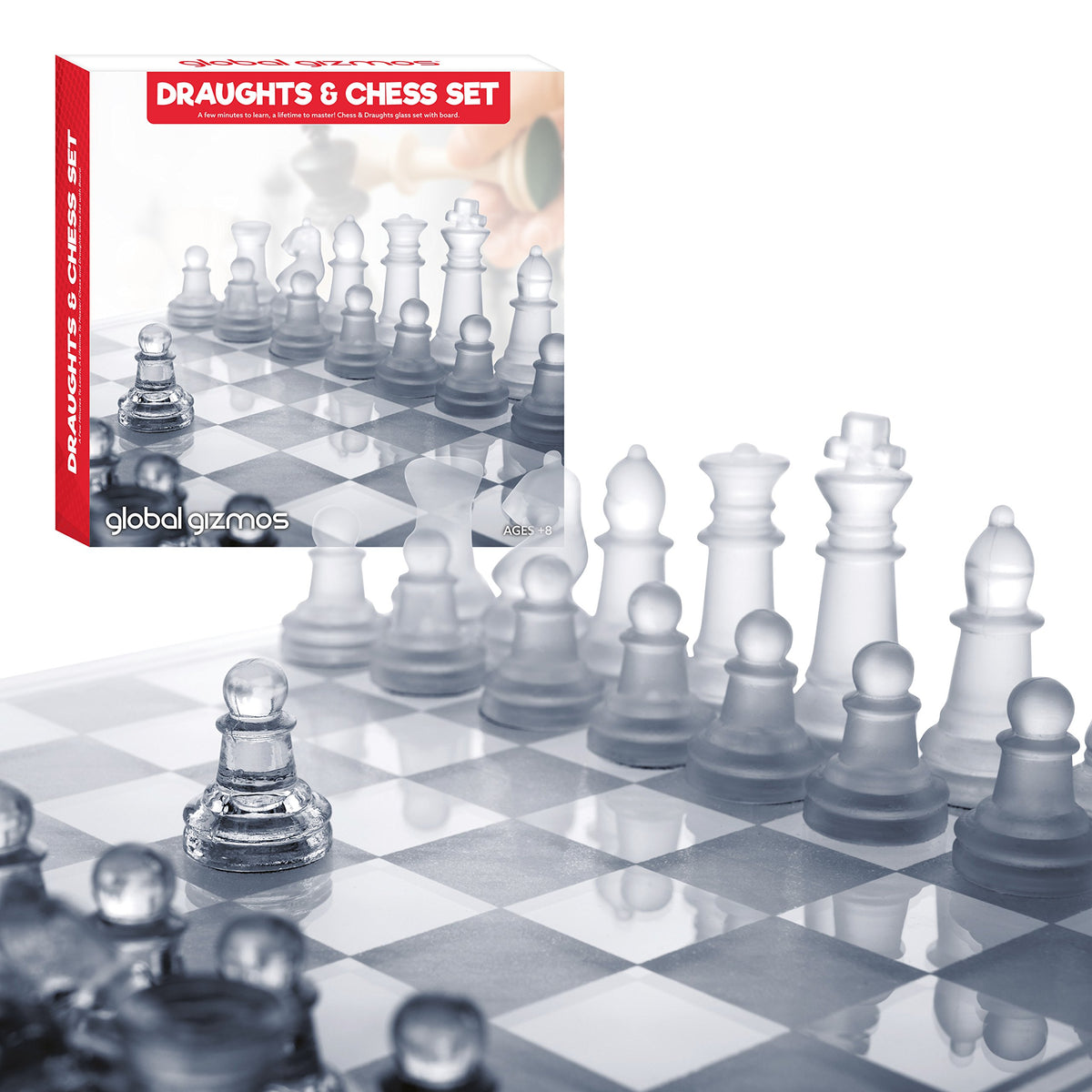 Clear and frosted glass chess pieces on board
