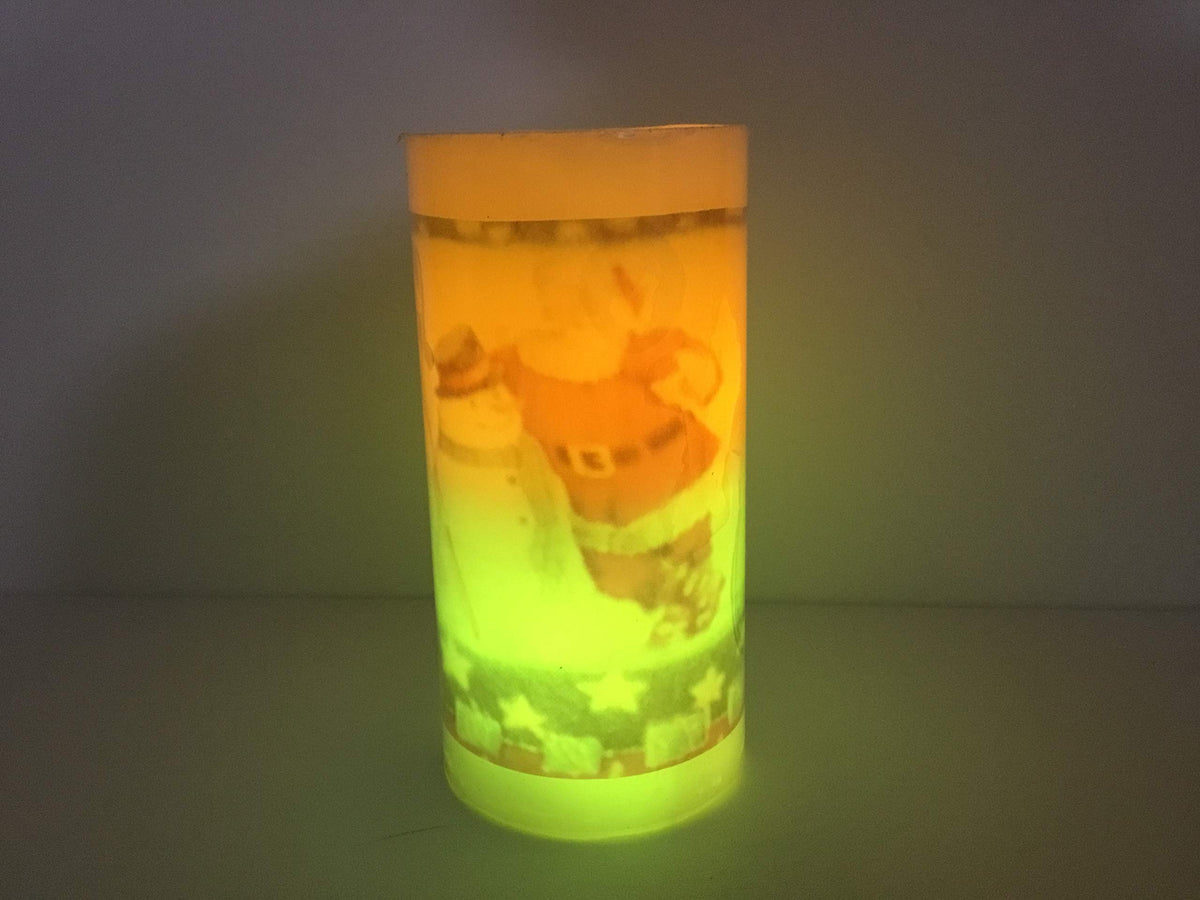 Flameless Santa Christmas pillar candle illuminated