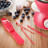 Compact red chocolate fondue pot with forks skewers and mould