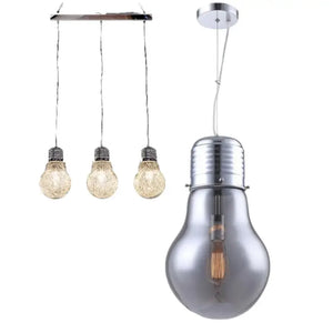 Three hanging light bulbs from the ceiling, illuminating the space with a soft and inviting light.