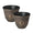 Two brown pots with designs placed on green grass.