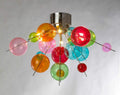 A chandelier featuring various colourful glass balls and bubbles used for the lighting collection.