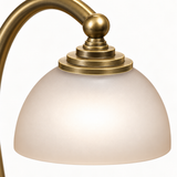 Close-up of the frosted glass shade and brass finish on the Aurora candle warmer lamp