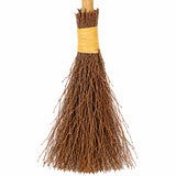 Close-up of brown twig bristles and wrapped binding on Halloween witches broomstick