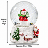 15cm snowman Christmas snow globe displayed on a festive mantel