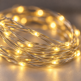 Close-up of warm white USB LED string lights on silver wire