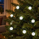 25 white berry LED Christmas lights on a tree with green cable