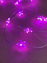 Pink star-shaped LEDs on flexible copper wire