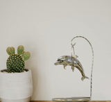 Gold-plated dolphin ornament with crystal detail and mirrored stand