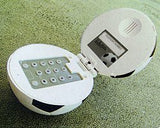 Novelty football-shaped telephone with hidden keypad