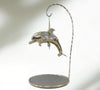 Gold-plated dolphin ornament with crystal detail and mirrored stand