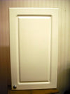 White bathroom storage cabinet with chrome-effect handle