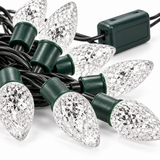 Close-up of clear faceted strawberry LED Christmas light covers