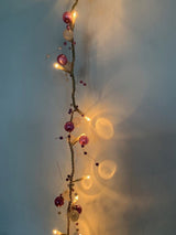 40 warm white LED rice lights with purple and white beads