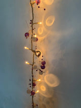 40 warm white LED rice lights with purple and white beads