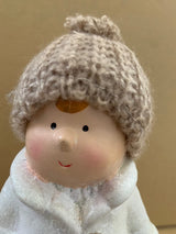 White ceramic Boy with creme coloured woolen hat